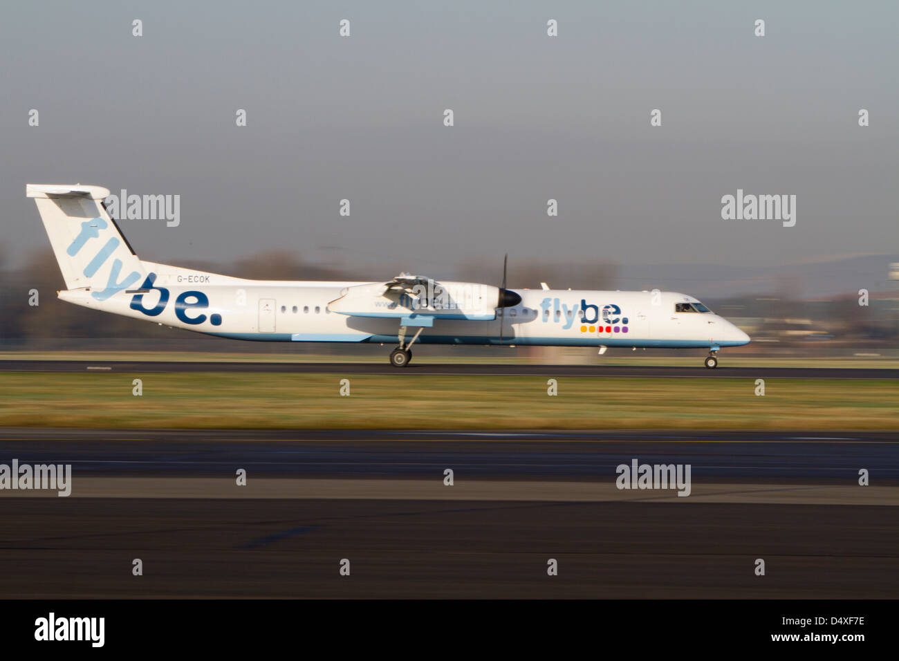 Flybe Saab 340 twin prop airplane takes of from Glasgow airport. Stock Photo