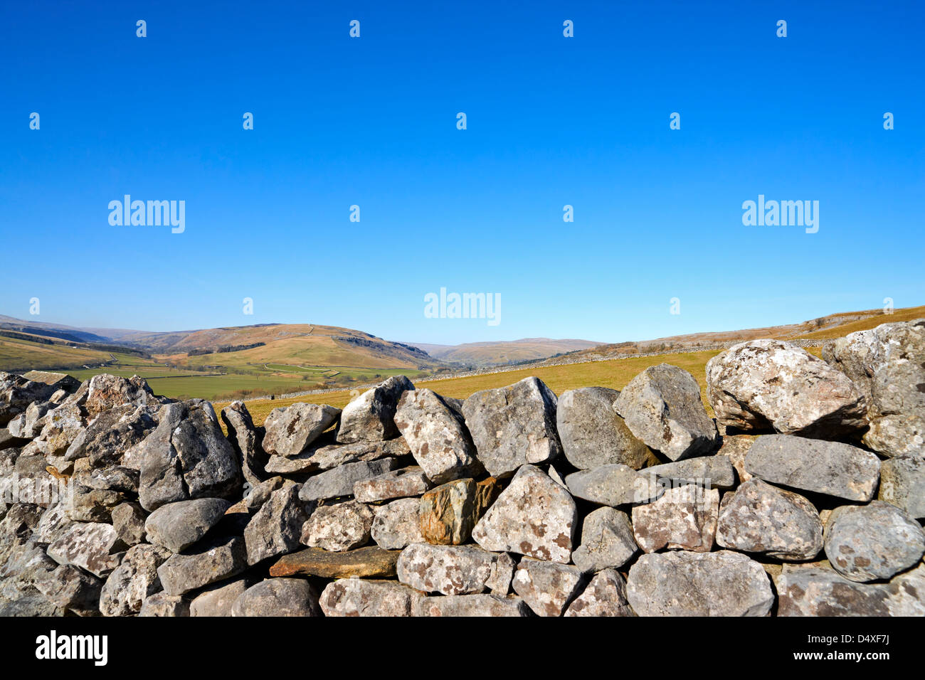 Looking over a drystone wall towards Old Cote Moor in the Yorkshire Dales Stock Photo