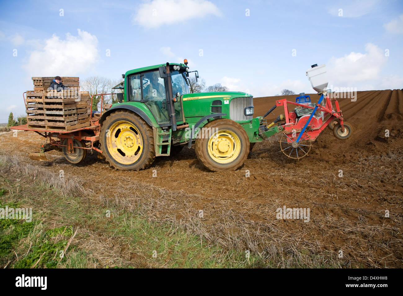 Farm machinery planting a crop of potatoes in a field, Shottisham, Suffolk, England Stock Photo