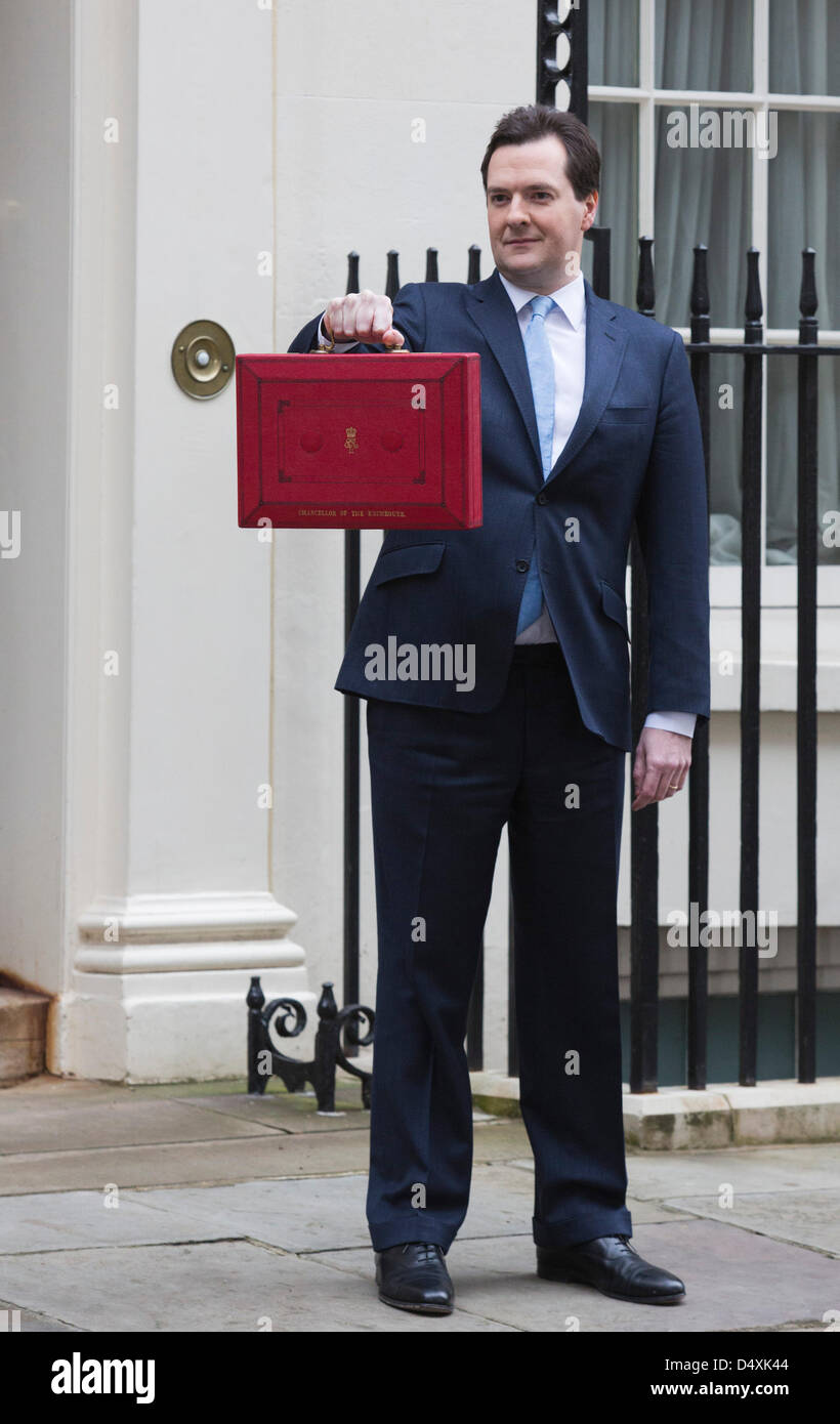 Wednesday, 20 March 2013, London, UK. George Osborne, Chancellor Of The Exchequer, holds his red ministerial despatch box outside 11 Downing Street In London, before the presentation of the annual budget in Parliament. Credit: Nick Savage/Alamy Live News Stock Photo