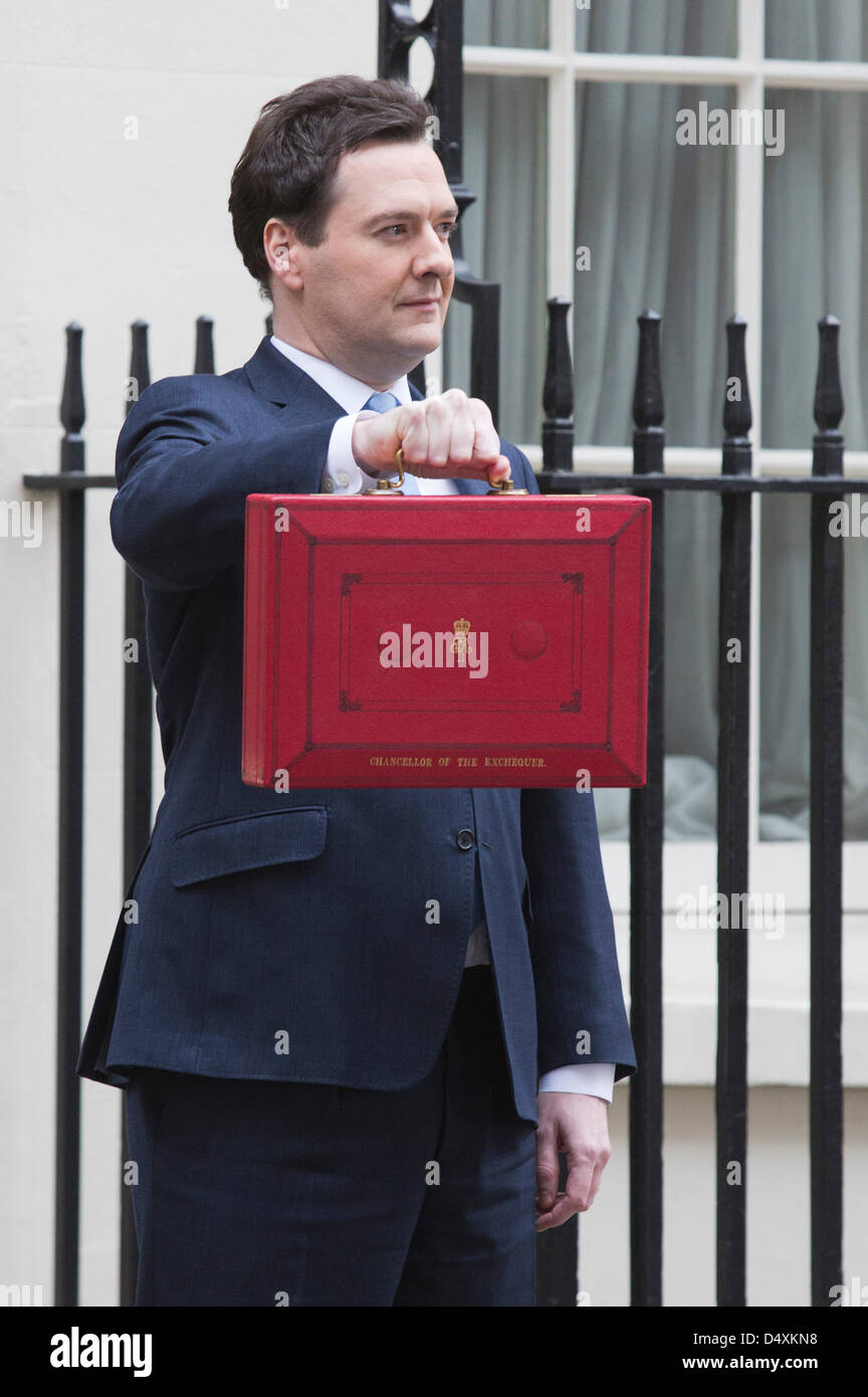 Wednesday, 20 March 2013, London, UK. George Osborne, Chancellor Of The Exchequer, holds his red ministerial despatch box outside 11 Downing Street In London, before the presentation of the annual budget in Parliament. Credit: Nick Savage/Alamy Live News Stock Photo