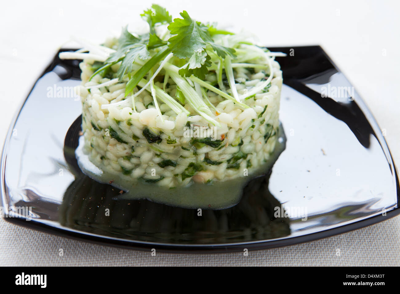 delicious risotto with spinach and chopped greens, closeup Stock Photo