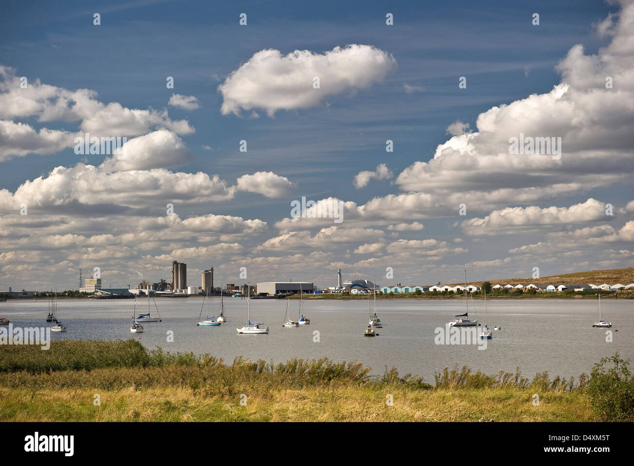Small boats and dinghies moored on the River Thames near Erith, Kent, UK Stock Photo