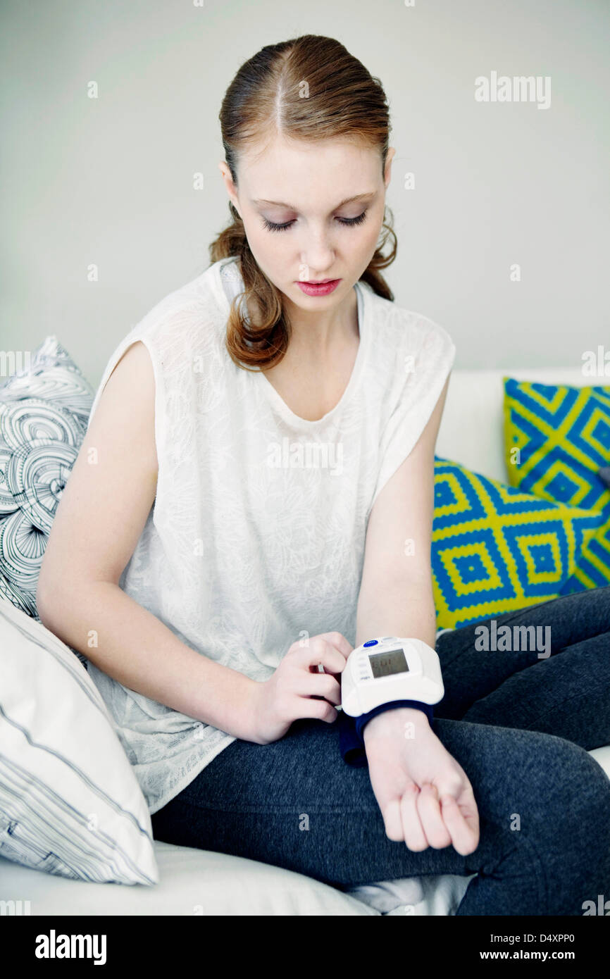 BLOOD PRESSURE, WOMAN Stock Photo Alamy