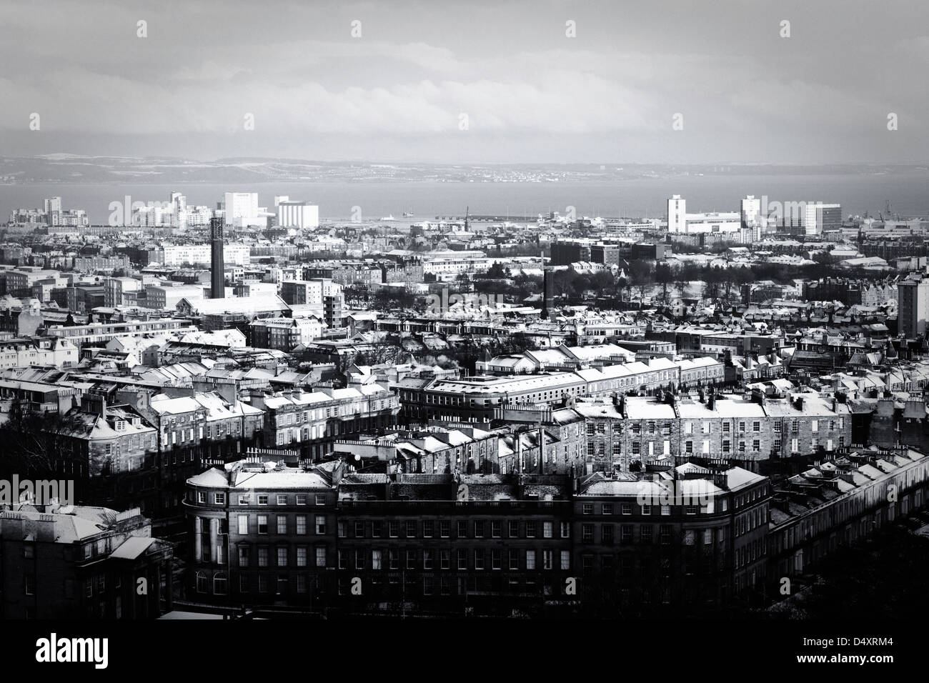 View from Carlton Hill in Edinburgh of Leith roof tops with snow on them and ground. Stock Photo