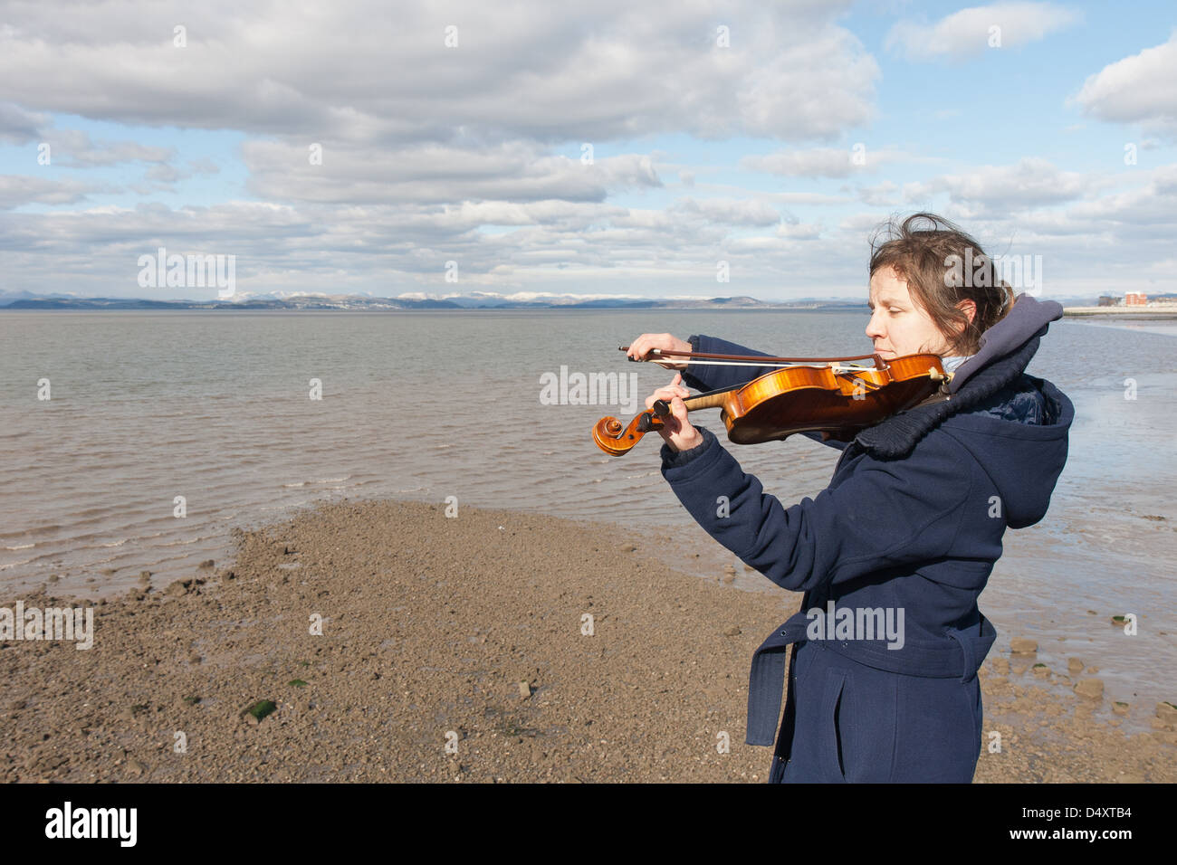 Young woman sea playing violin hi-res stock photography and images - Alamy