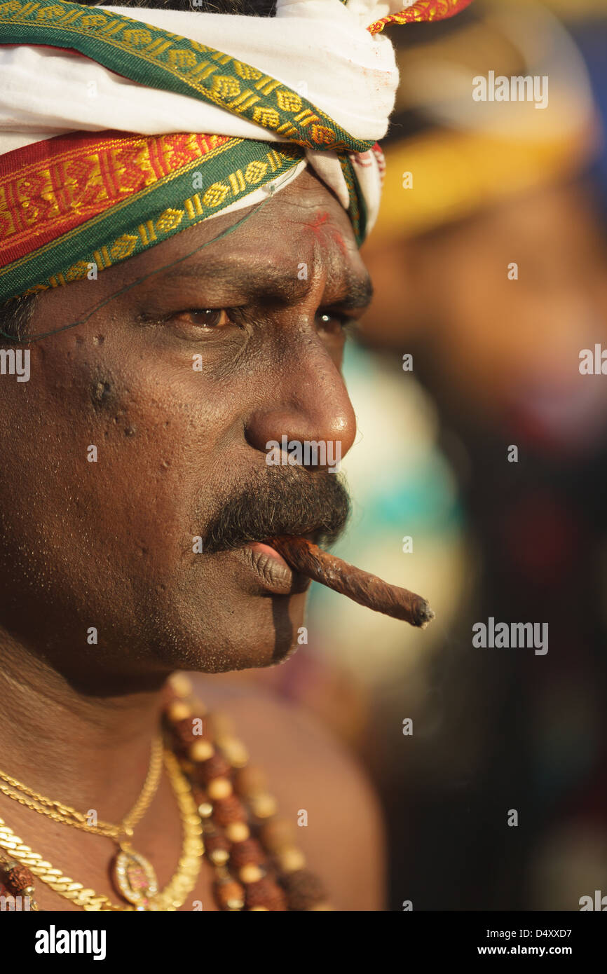 tobacco in hinduism Hindu devotee smoking cigar in annual Thaipusam religious festival in Batu  Caves, near Kuala Lumpur, Malaysia Stock Photo