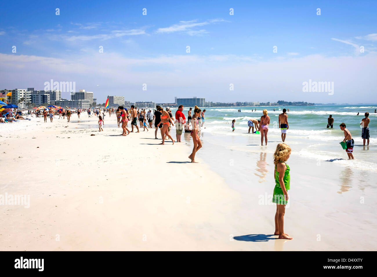 People enjoying the sunshine on Siesta Key beach Florida during Spring
