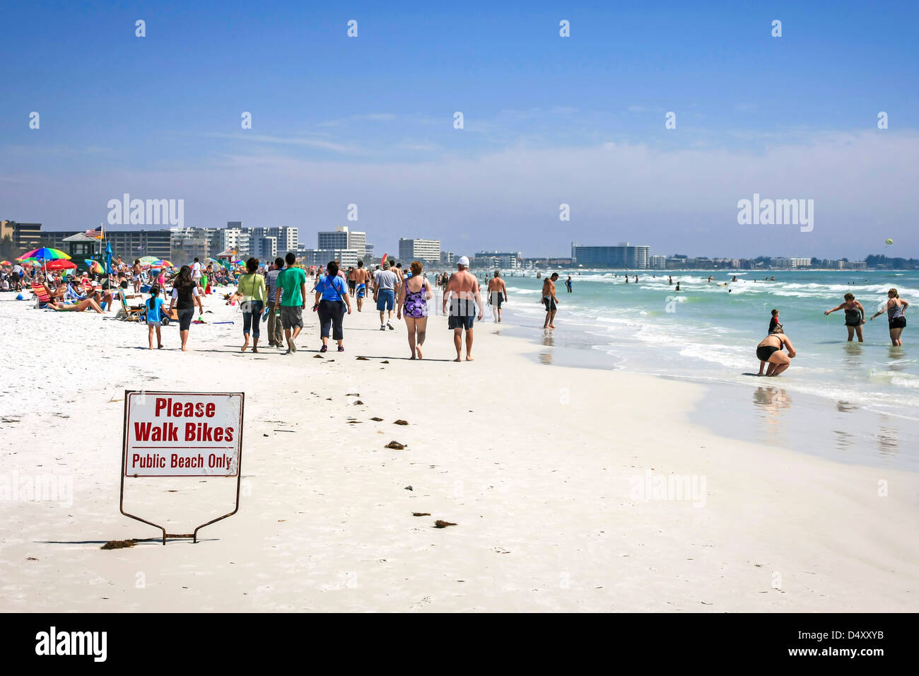 People enjoying the sunshine on Siesta Key beach Florida during Spring