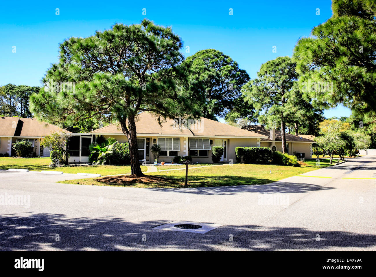 Street view and walled housing development in Sarasota Florida Stock Photo