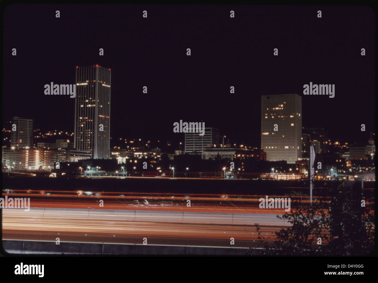 Downtown Core Area of Portland, after 7 P.M. on November 2 1973, During the State's Energy Crisis with Few Commercial and Neon Lighting Displays. This Photo Looks Toward the West with the Willamette River in the Foreground 11/1973 Stock Photo