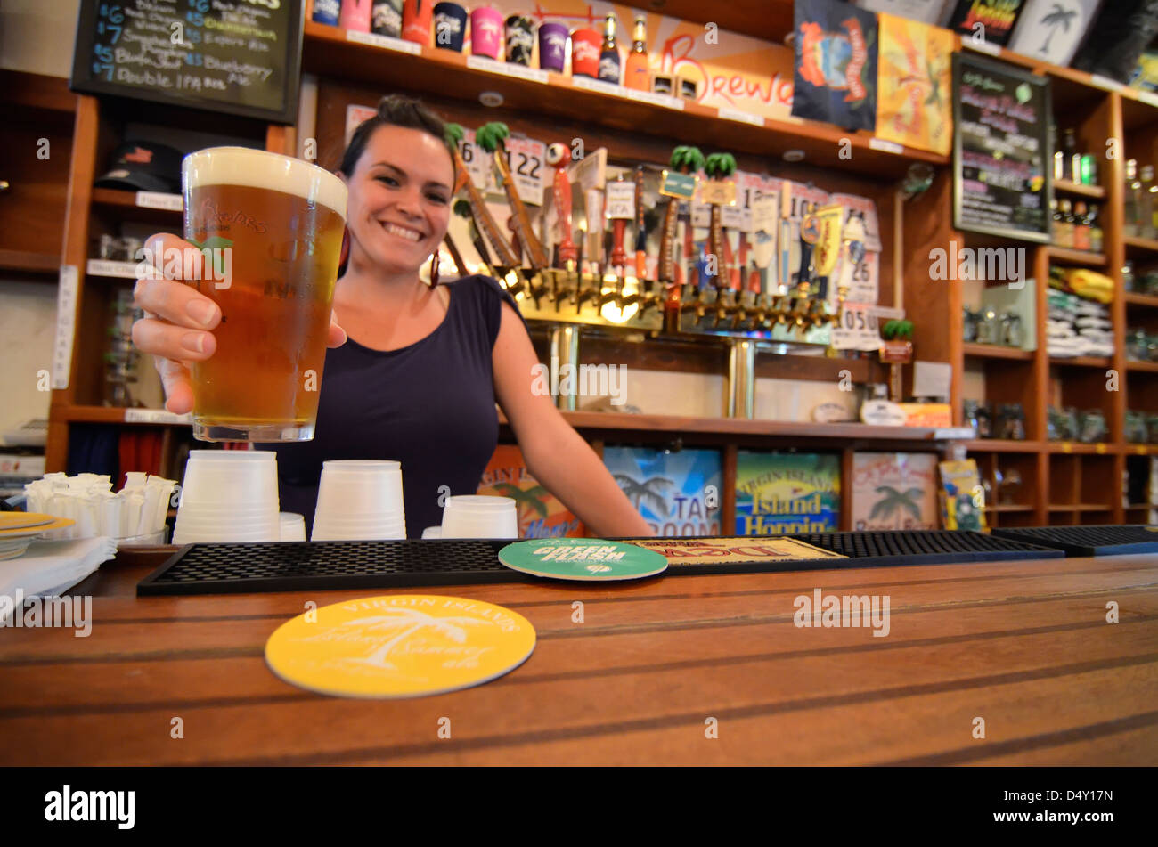 Bartender with a beer at the Tap Room, a brew pub in Cruz Bay, St. John