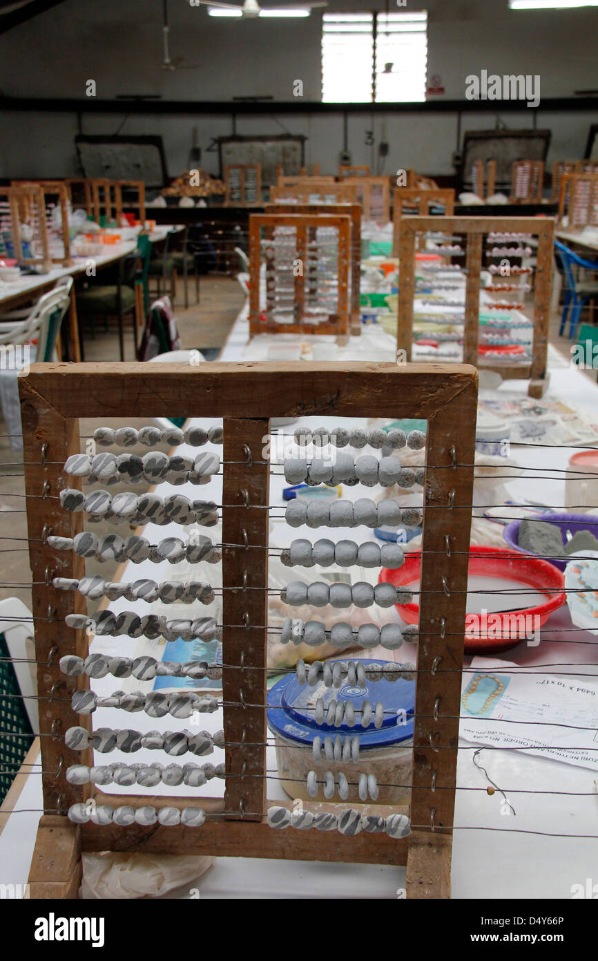 Africa, Kenya, Nairobi. Bead Drying Rack at the Kazuri bead making