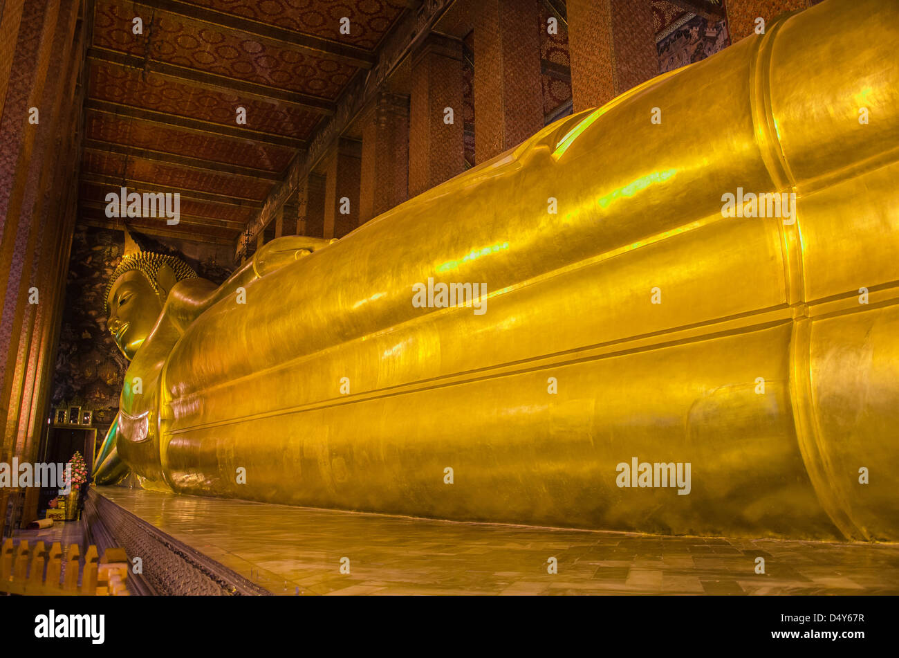 Details of the golden reclining Buddha in Wat Po Bangkok Stock Photo