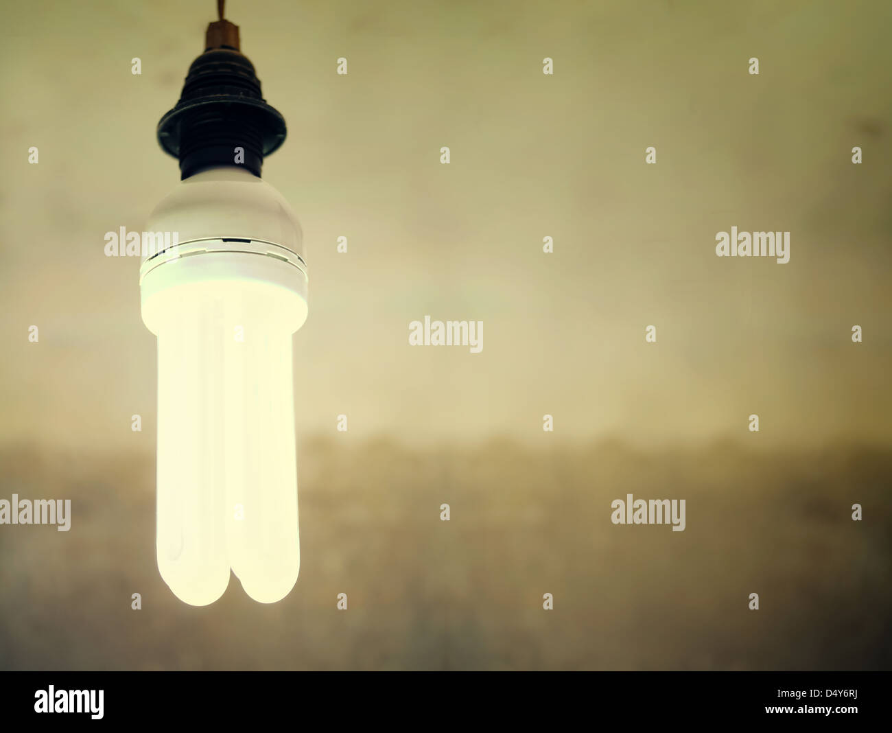 energy saving light bulb at blur background Stock Photo - Alamy