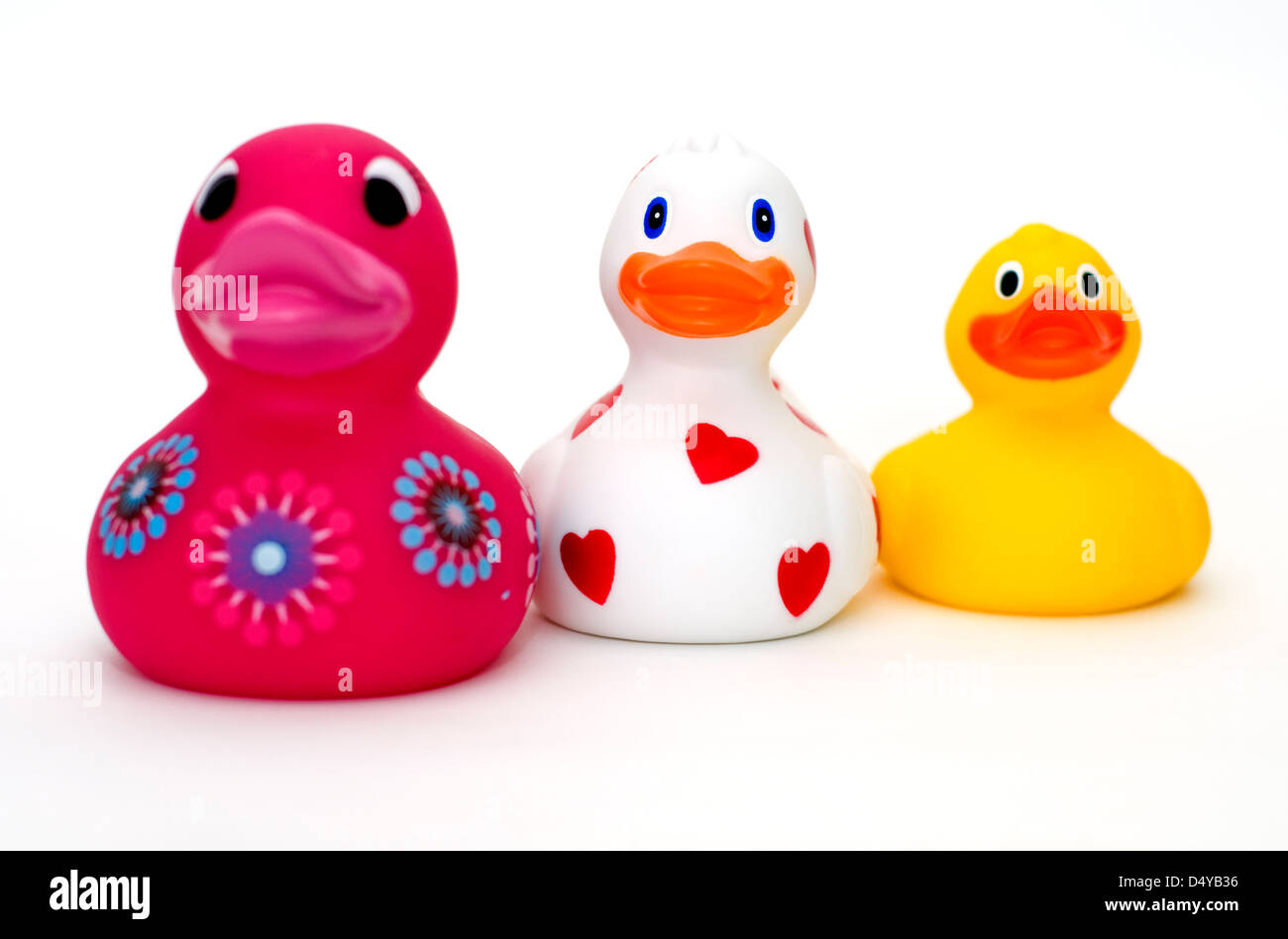 Three colourful rubber ducks on a white background Stock Photo