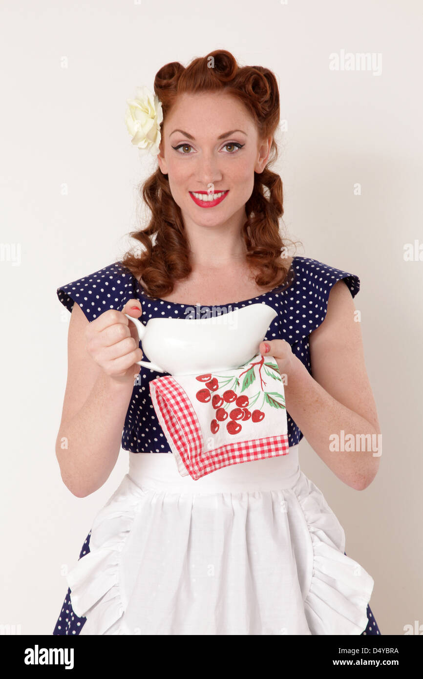 Woman holding a gravy jug Stock Photo Alamy