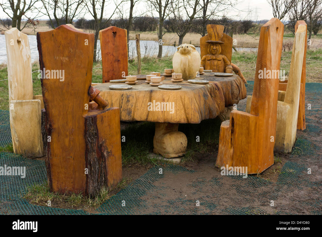 Wooden Sculpture Mad Hatter's Tea Party at the RSPB Saltholme wildlife reserve and discovery park Stock Photo