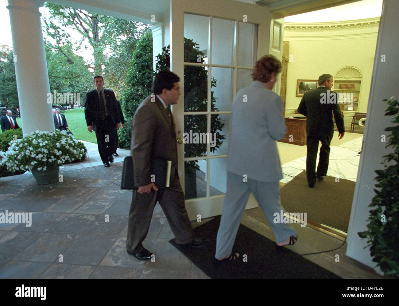 Counselor Karen Hughes and Counsel Alberto Gonzales follow President George W. Bush into the Oval Office Tuesday, Sept. 11, 2001 after his return to the White House. Photo by Paul Morse, Courtesy of the George W. Bush Presidential Library Stock Photo
