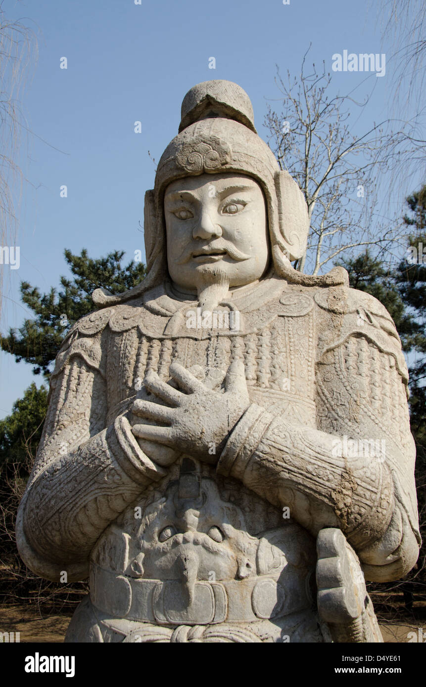China, Beijing. Changling Sacred Way. 14th century Ming Dynasty warrior statue in traditional costume. Stock Photo