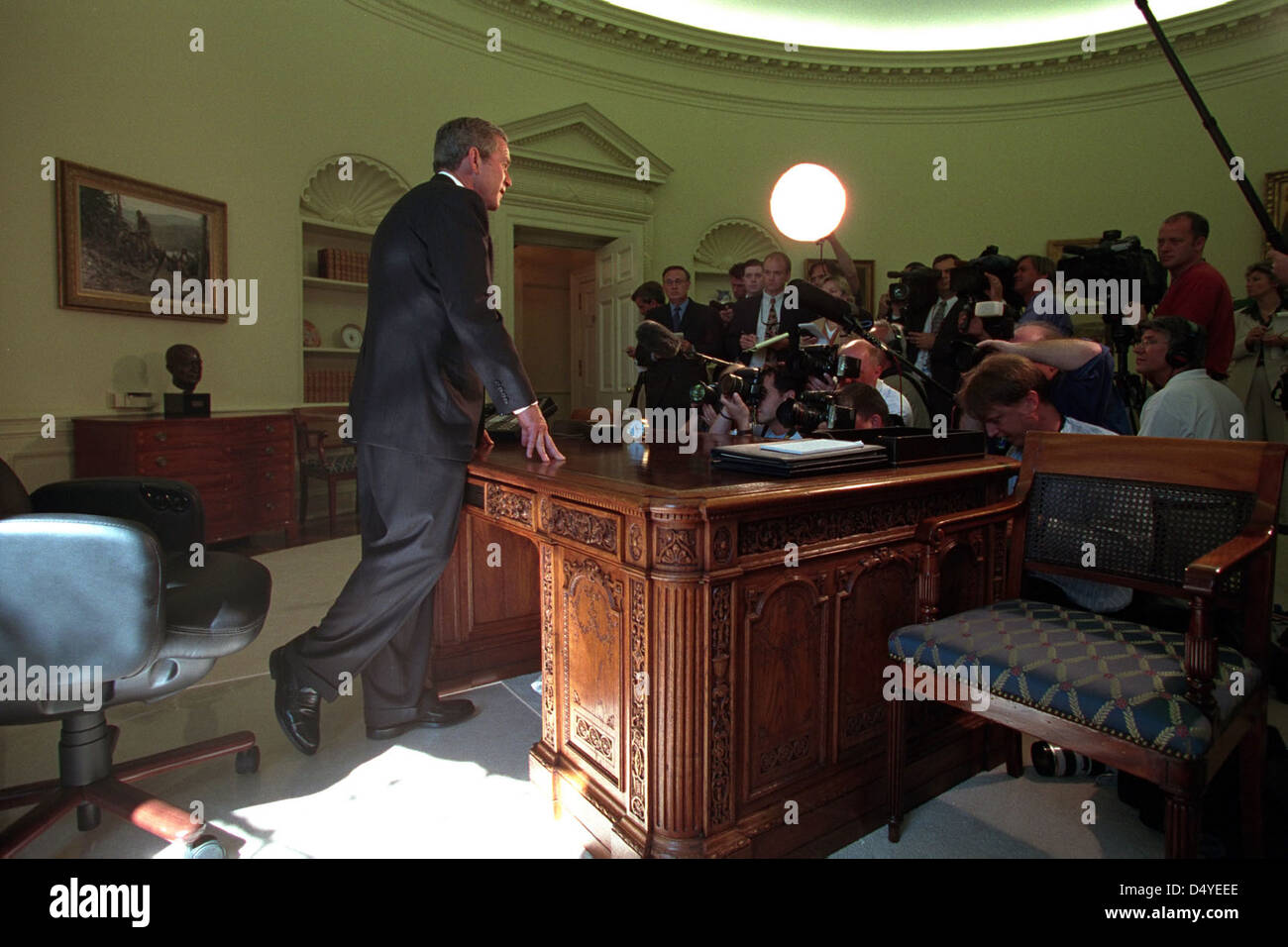 President W. Bush addresses reporters in the Oval Office