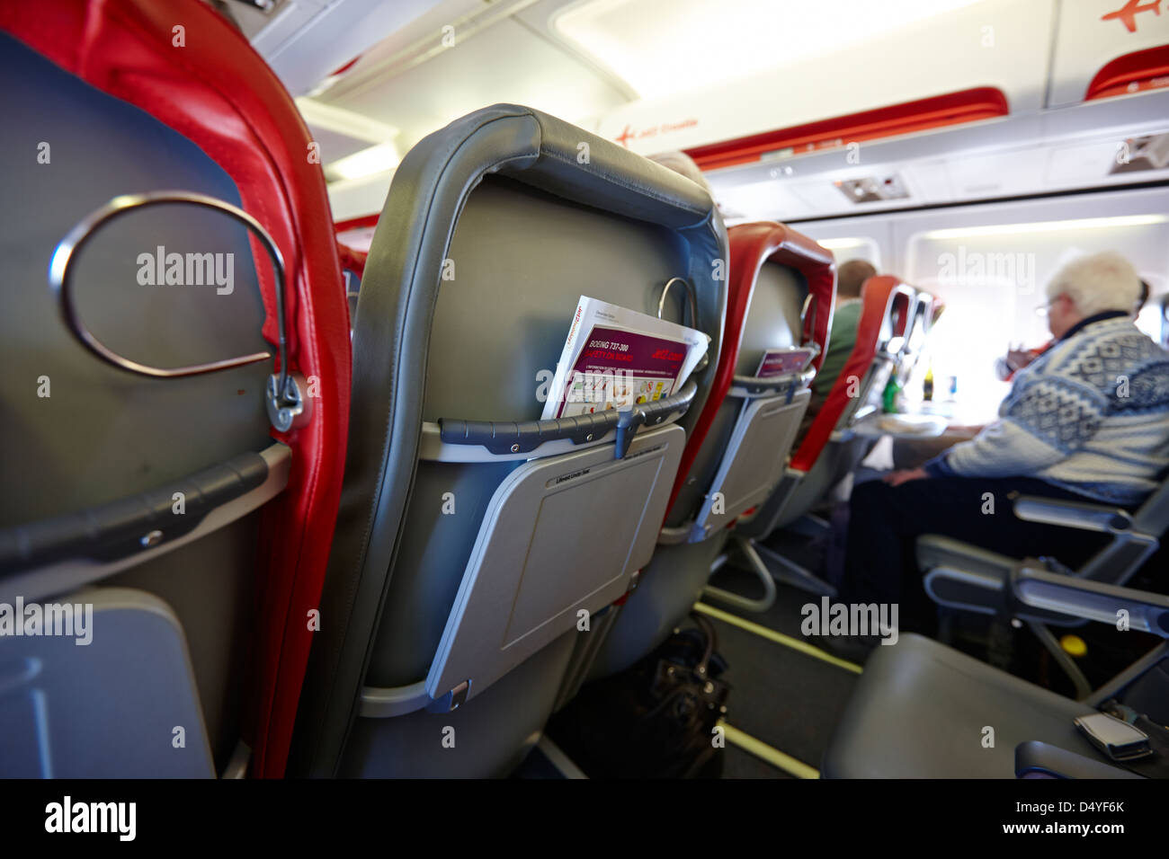 safety card and in flight magazine in seat pocket interior of jet2 aircraft passenger cabin in flight europe Stock Photo