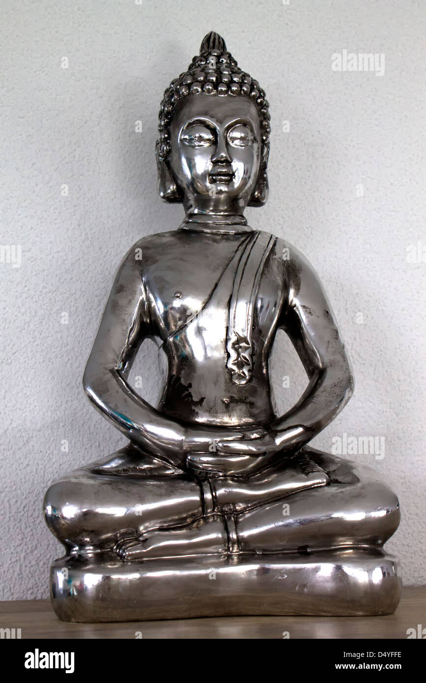 Silver statuette of Buddha Stock Photo