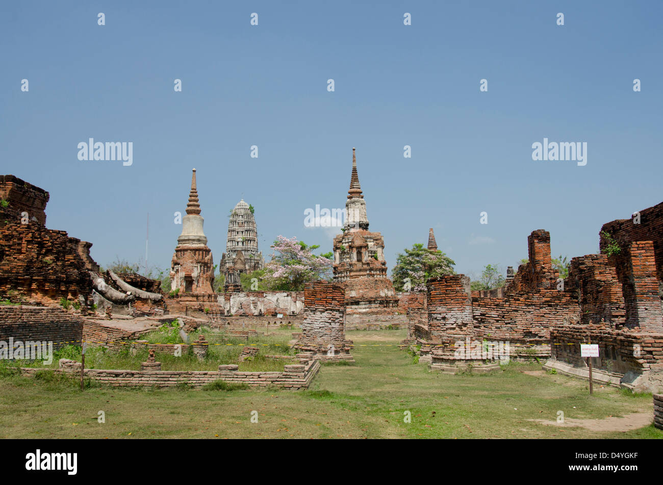 Thailand, Ayutthaya. Wat Mahathat. Traditional Thai bell-shaped Chedi or Stupa temples, with Prang wat in distance. Stock Photo