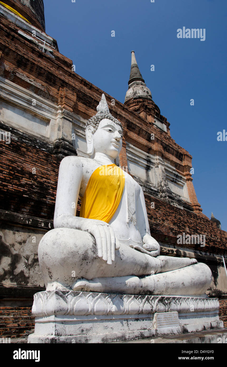 Thailand, Ayutthaya. Wat Phra Chao Phya-thai (aka Wat Yai Chai-mongkol). Buddha statue dressed in yellow robe. UNESCO Stock Photo