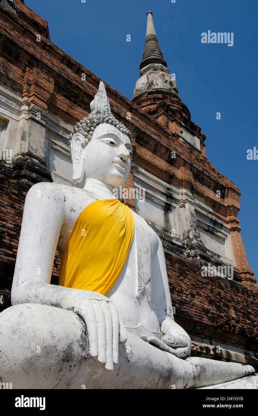 Thailand, Ayutthaya. Wat Phra Chao Phya-thai (aka Wat Yai Chai-mongkol). Buddha statue dressed in yellow robe. UNESCO Stock Photo