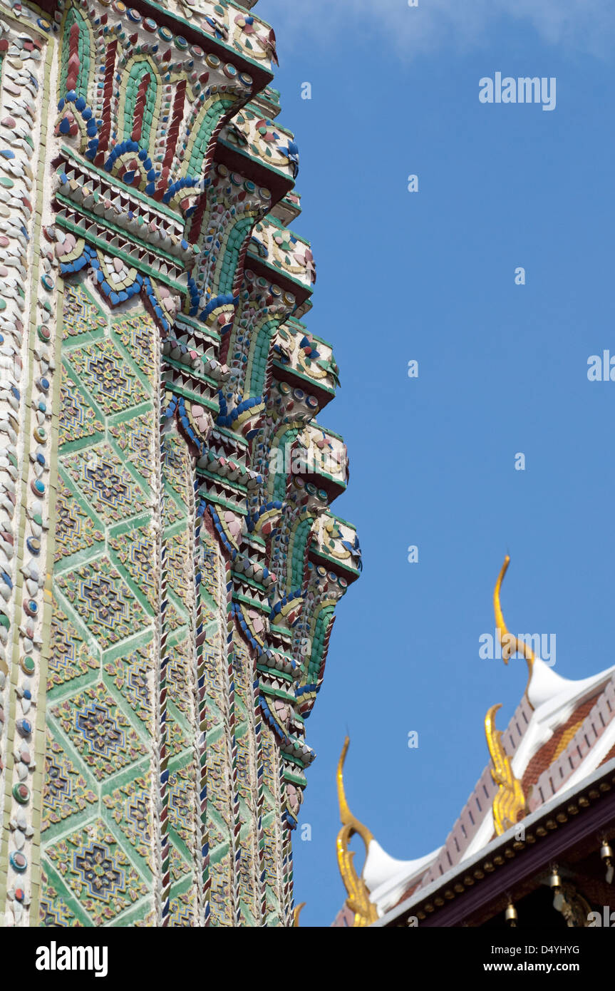 Thailand, Bangkok. The Grand Palace, established in 1782. Bell Tower covered in ornate tiny porcelain fitted pieces. Stock Photo