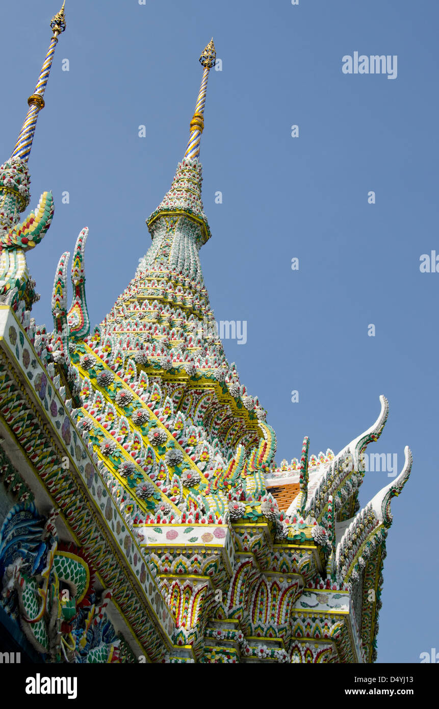 Thailand, Bangkok. The Grand Palace, established in 1782. Bell Tower covered in ornate tiny pottery tiles, roof detail. Stock Photo