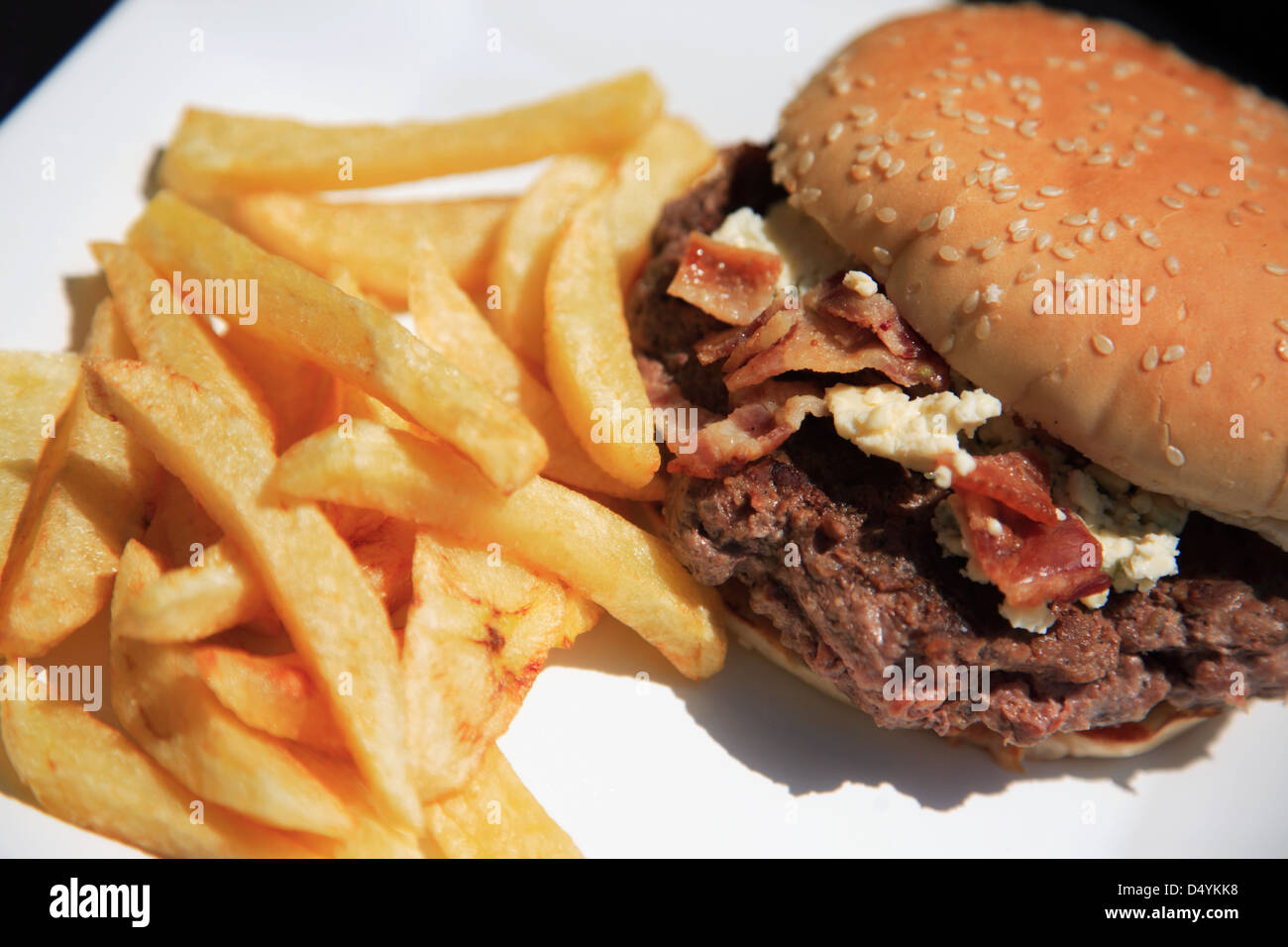 Looking down on a juicy beef burger and fries Stock Photo