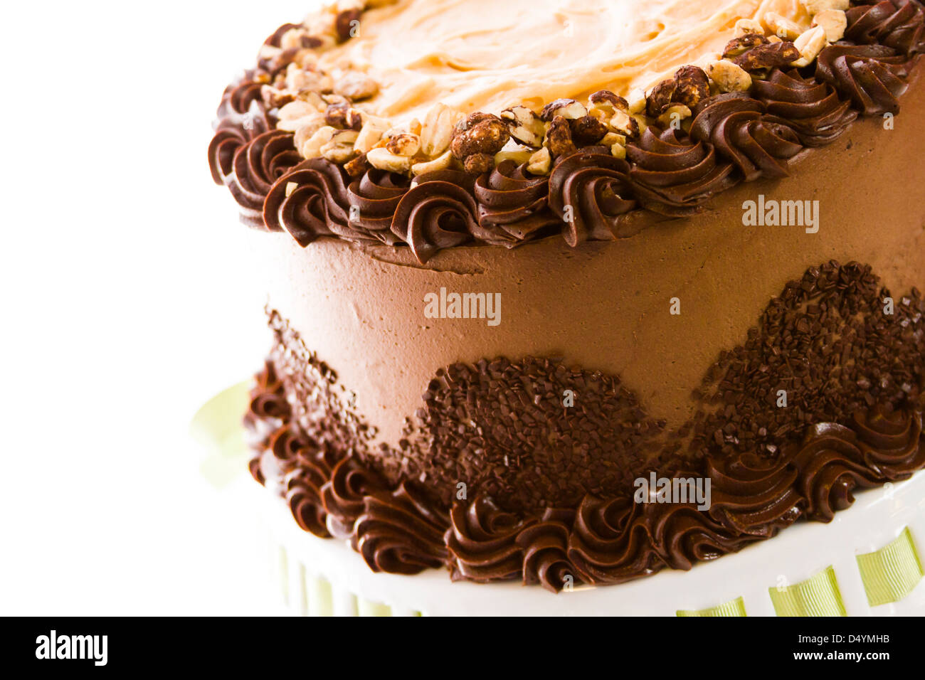 Peanut butter mousse cake with two layers of chocolate cake, filled and