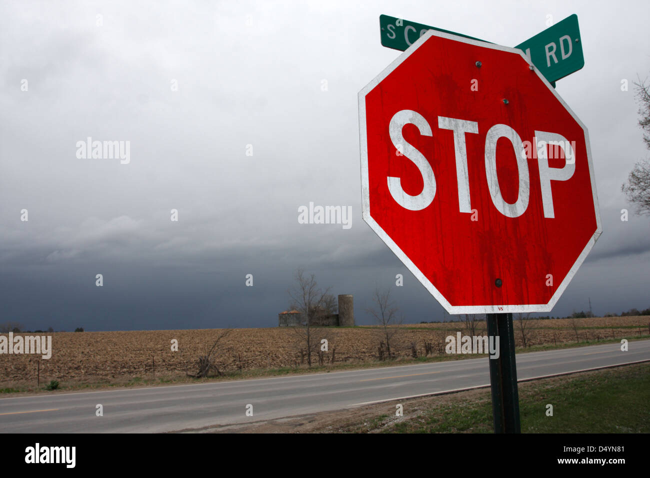 Stop sign at rural intersection Stock Photo - Alamy