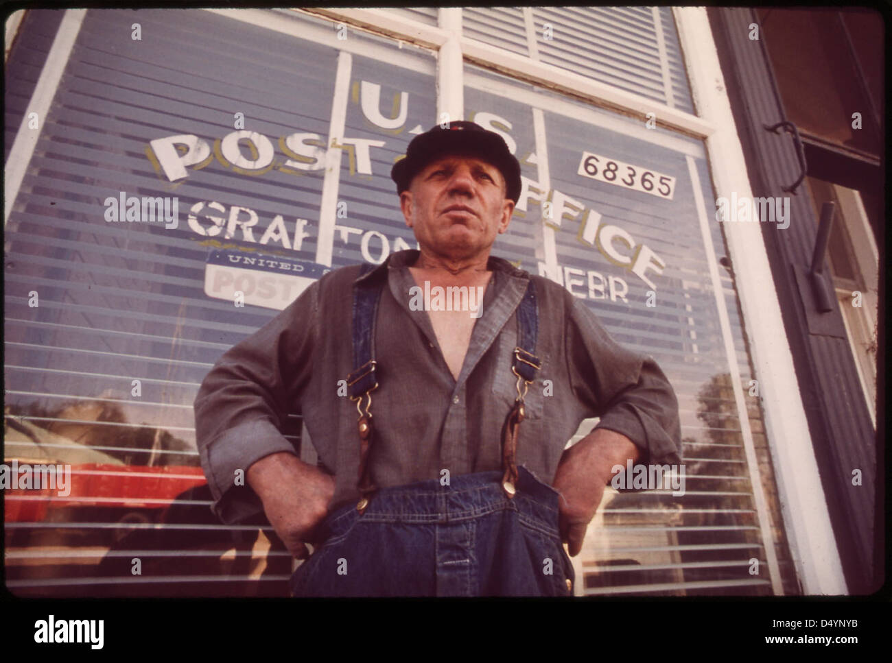 Charlie Gross outside Grafton post office. A former farmer truck driver, boxer, dog raiser and salesman, he has lived in Nebraska more than half his life, May 1973 Stock Photo