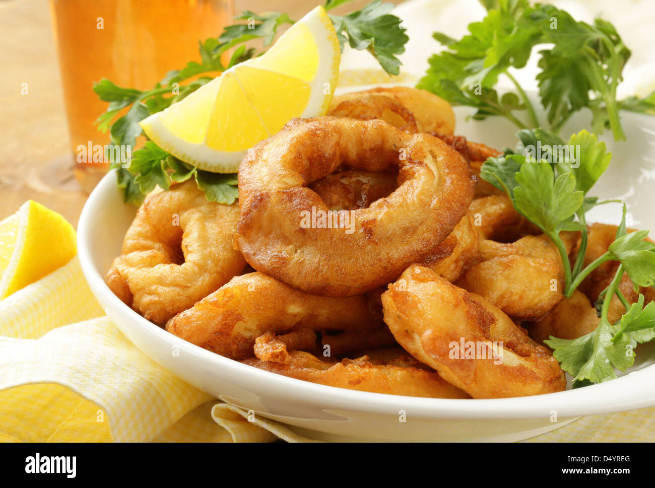 Fried calamari rings dipped batter hi-res stock photography and images