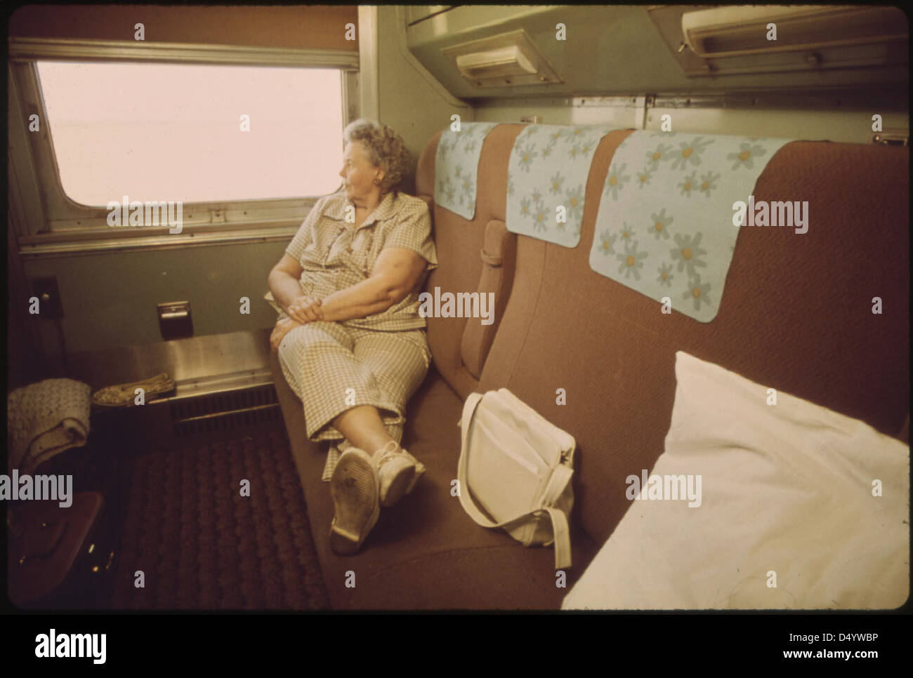 Traveler relaxes in the privacy of her compartment on the Empire Builder passenger train enroute from Chicago to East Glacier Park, Montana, and Seattle, Washington, June 1974 Stock Photo