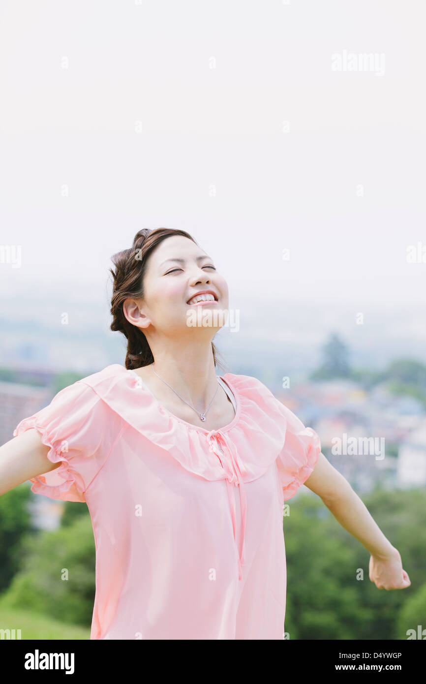 Japanese woman smiling with closed eyes Stock Photo - Alamy
