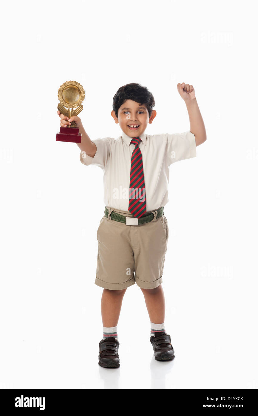 Paperboy Trophy Schoolboy holding a trophy Stock Photo - Alamy