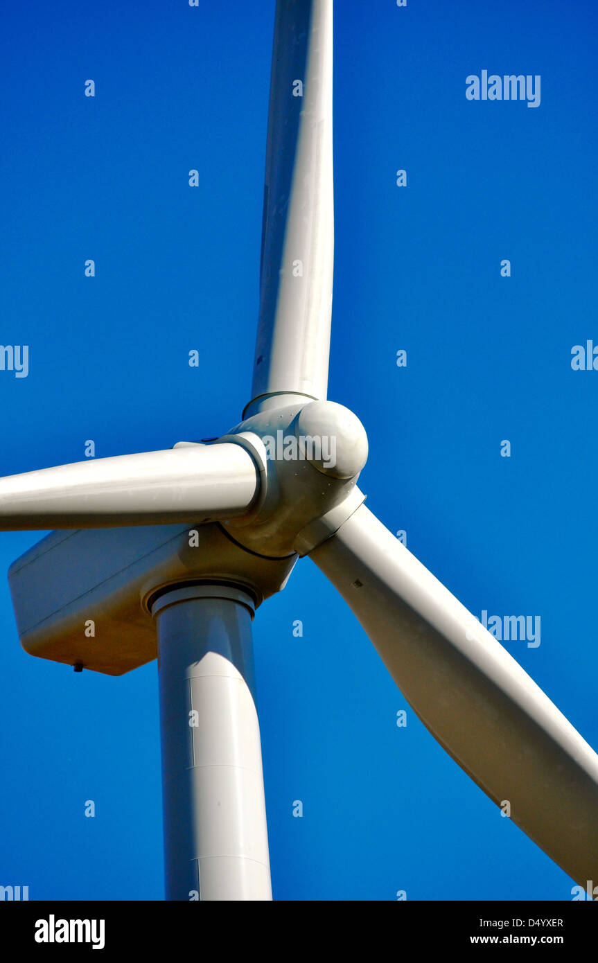 A windmill farm rotates over a Northwestern Indiana farm field Stock