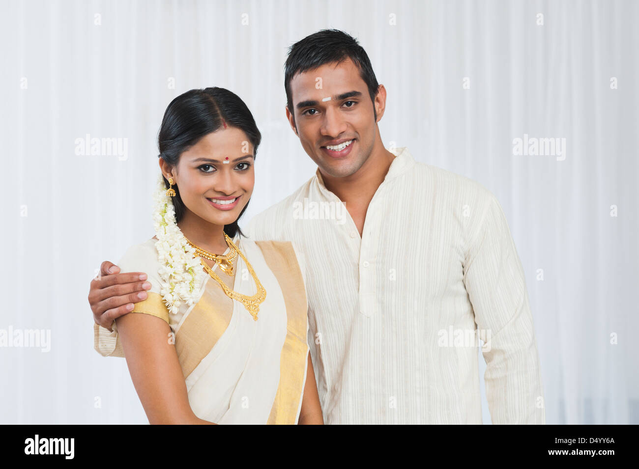 Portrait of a South Indian couple smiling Stock Photo - Alamy