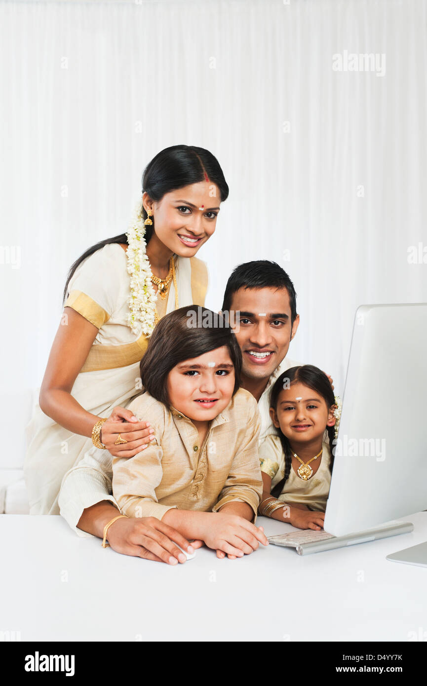 South Indian family using a desktop computer Stock Photo - Alamy