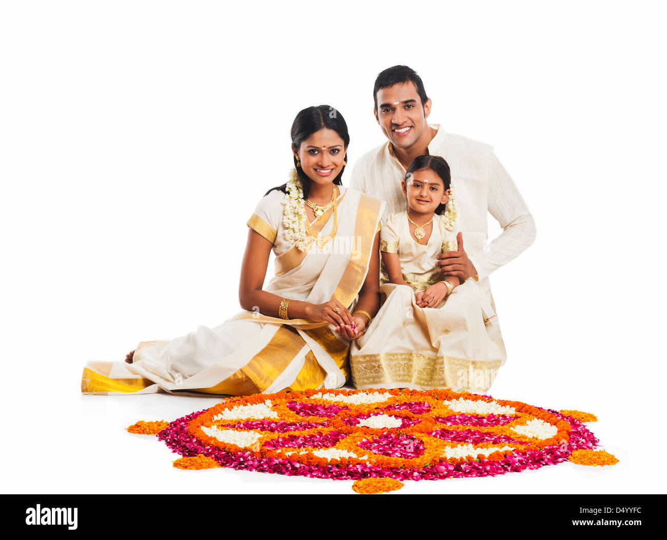 South Indian family making a rangoli of flowers at Onam Stock Photo - Alamy