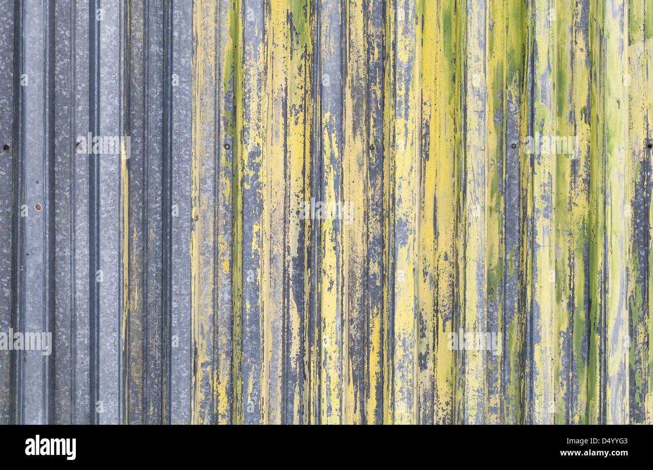 Ridged yellow painted old metal wall background texture Stock Photo - Alamy