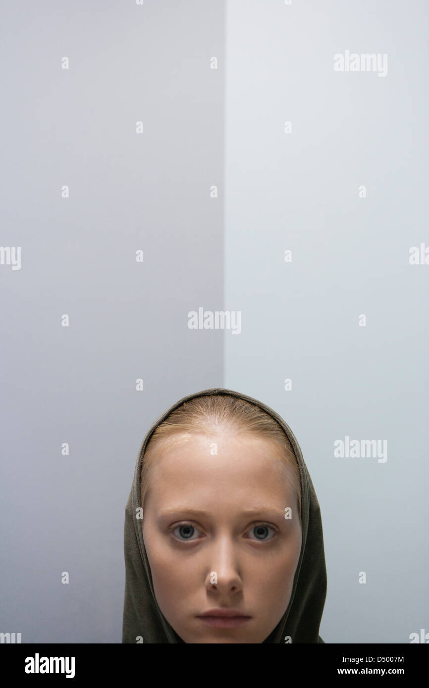 Young woman wearing hood, portrait Stock Photo Alamy