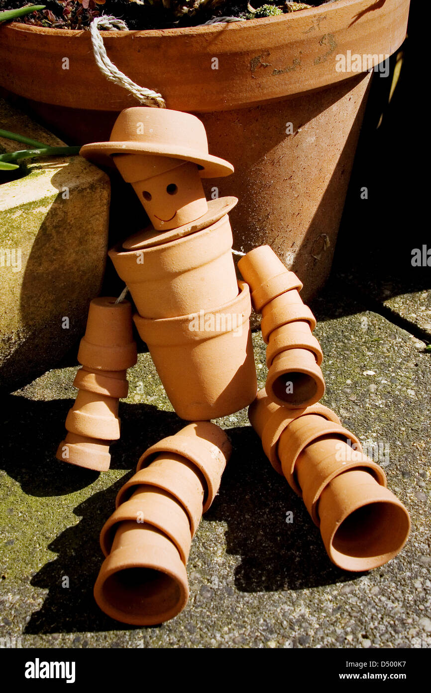 Terracotta flower pot man Stock Photo Alamy