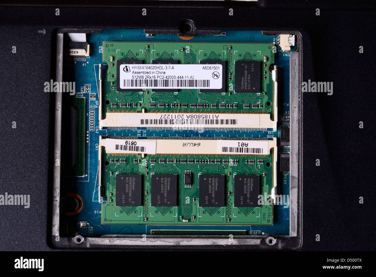 Random Access Memory or RAM inside a compartment within a laptop. Stock Photo