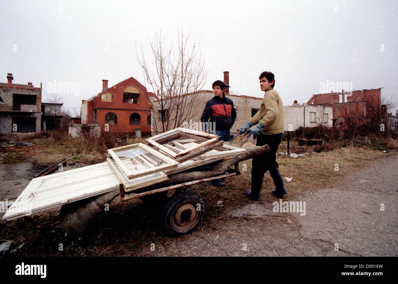 BRCKO, BOSNIA , 08 DECEMBER 1997 ---- Bosnian Moslem men rebuild their home in the contested Bosnian city of Brcko. Thousands of Moslems were ethnically cleansed from Brcko early on in the Bosnian conflict, but with NATO forces guaranteeing their safety many have returned. Stock Photo