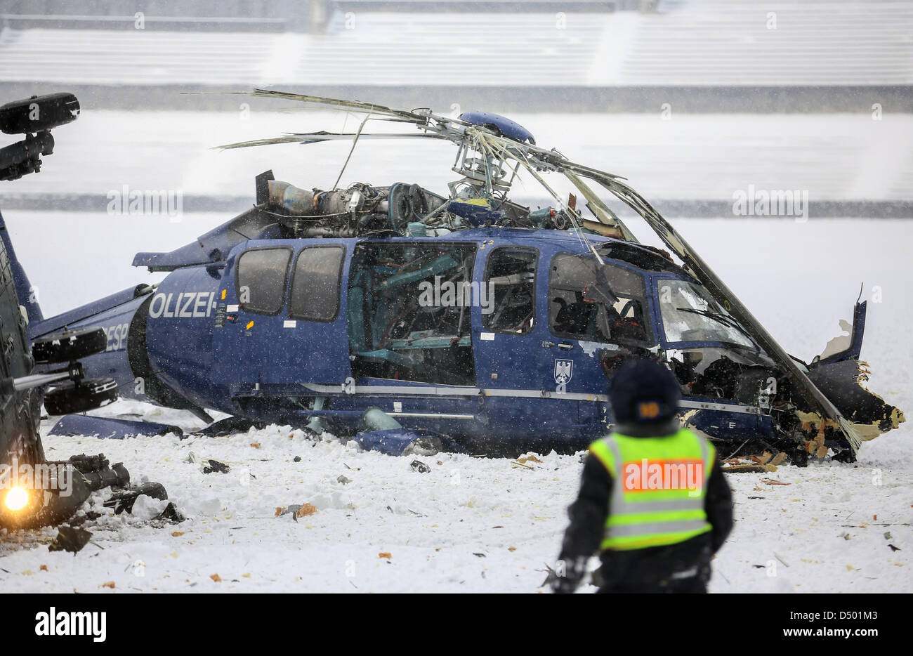 Berlin, Germany. 21 March 2013. Two crashed helicopters of the German federal police lie on the May field at the Olympic Stadium in Berlin.  During an exercise of the federal police the two helicopters collided as they approached for landing. Photo: HANNIBAL/DPA/Alamy Live News Stock Photo